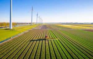 a combine working on a wind farm