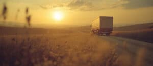 Truck Driving off Into the Sunset on a dirt road