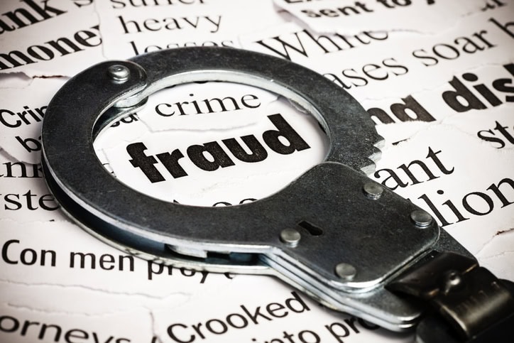 an image of a handcuff encircling the word fraud