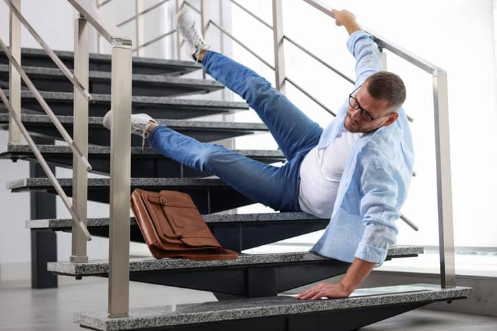 a man falls down a set of stairs